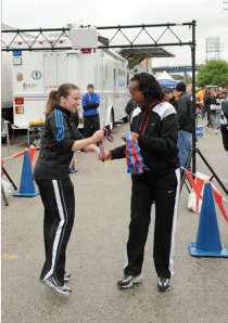 I simply do not get tired of this photo of Jackie Joyner Kersee  handing me a medal at Bridge The Gap.